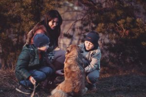 Family in nature with dog